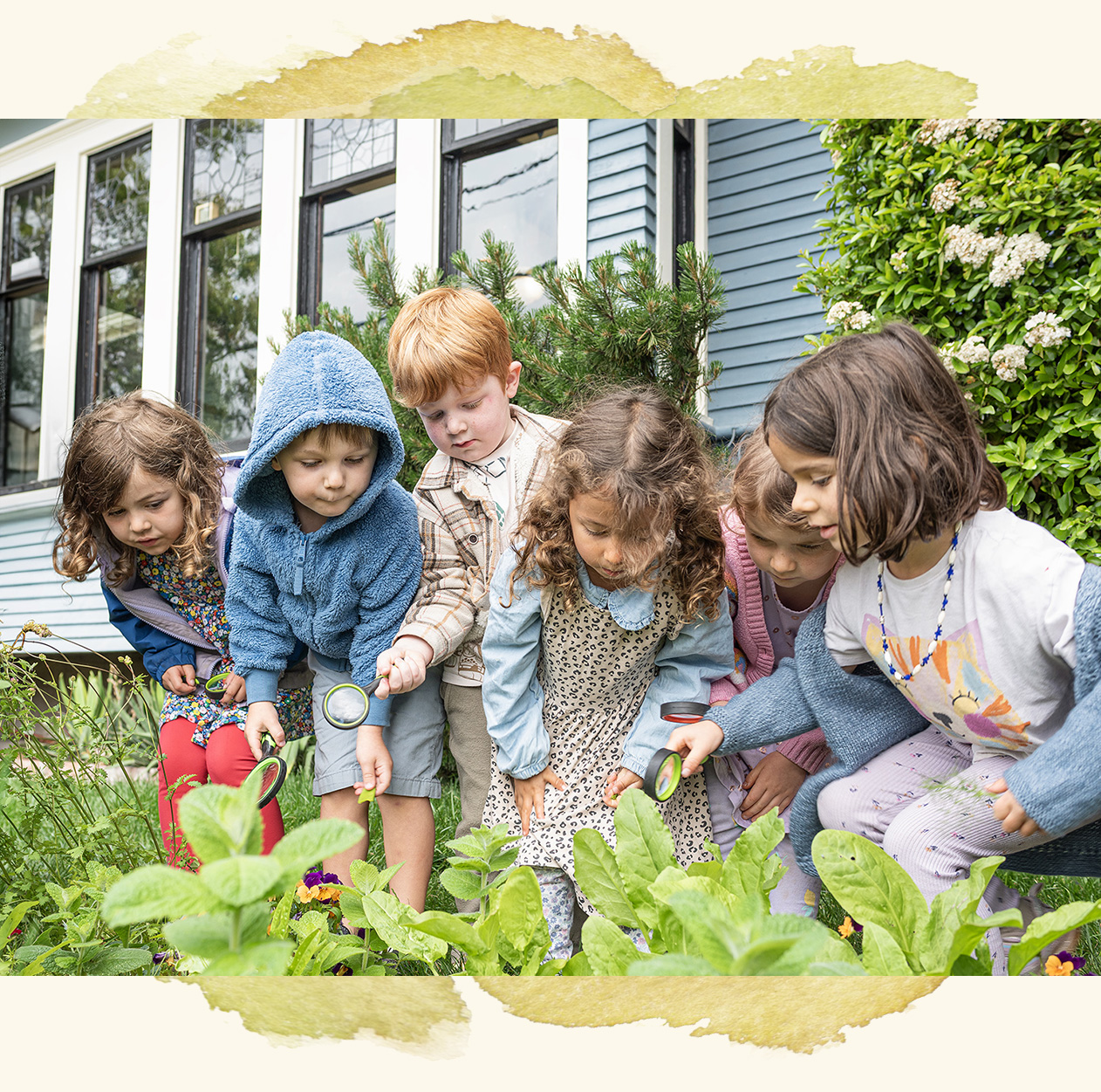 children exploring the outdoor classroom space at Woodland Park campus